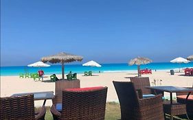 شاليه ارضى بحديقه بقريه ديمورا بالساحل الشمالي كيلو ٧٥